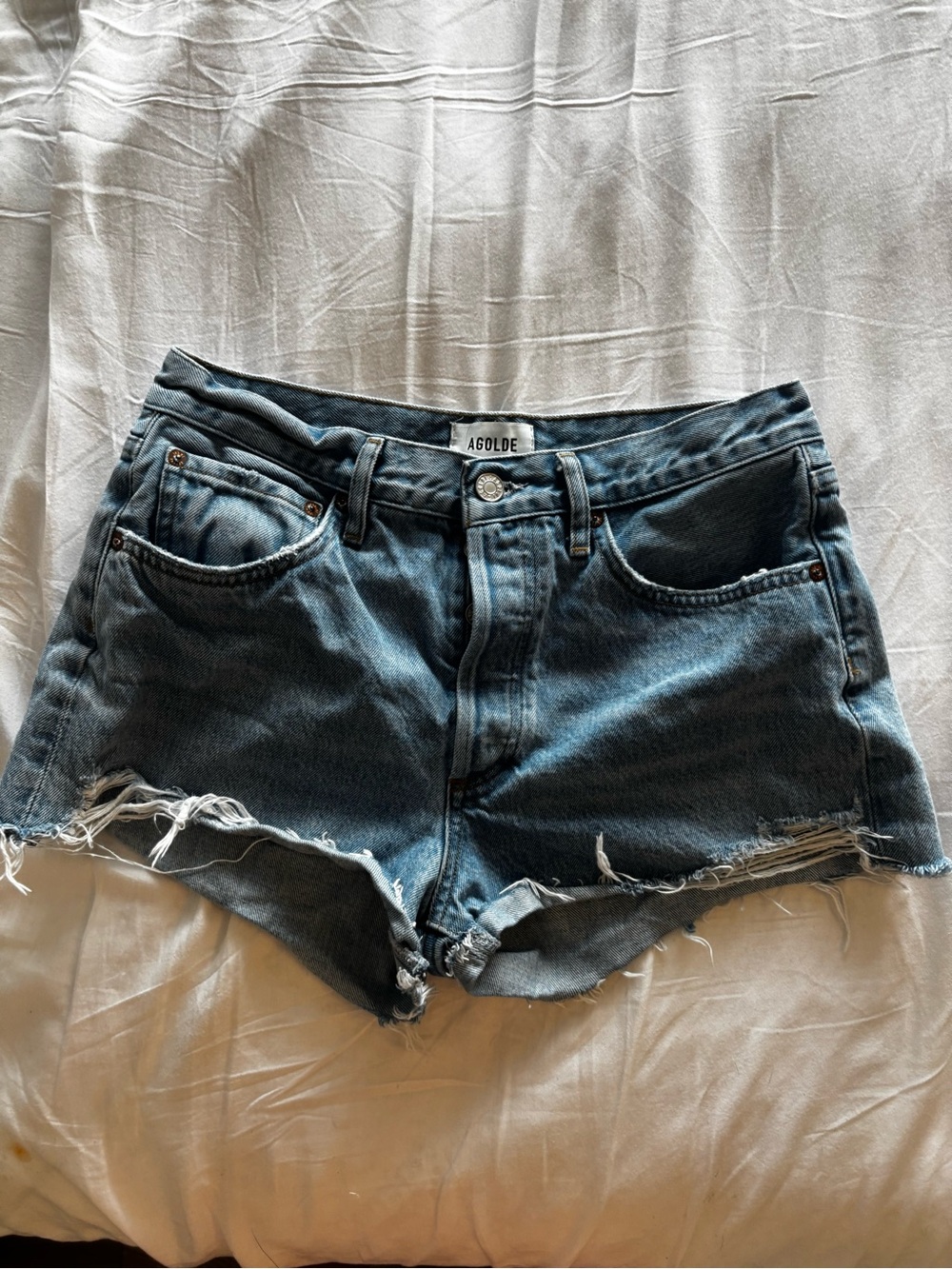 Agolde Distressed High-Rise Denim Cutoff Shorts in Washed Blue